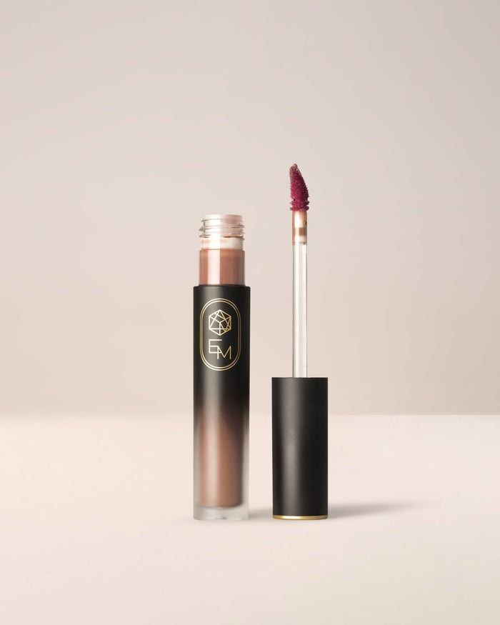 EM Cosmetics Phantom Blur Lip Tint in Truffle, a rich chocolate brown for a bold blurred lip look.