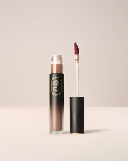 EM Cosmetics Phantom Blur Lip Tint in Truffle, a rich chocolate brown for a bold blurred lip look.