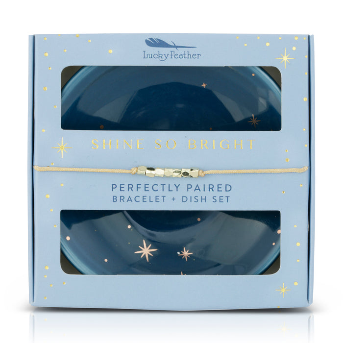 A 'Lucky Feather' gift box for a bracelet and dish set, with celestial imagery and gold accents.