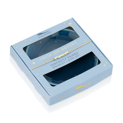 Boxed 'Lucky Feather' bracelet and dish set with a light blue star-patterned box and visible contents.
