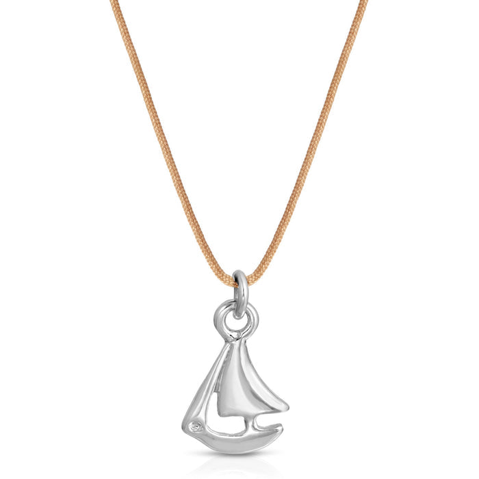 A silver sailboat pendant hangs from a light brown cord necklace.
