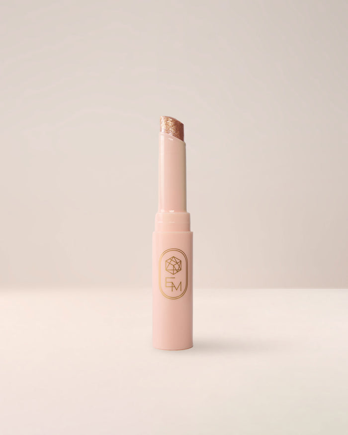 EM Cosmetics Three Wishes Glitter Wand in Gold, a high-shine liquid glitter for eyes.