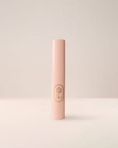 EM Cosmetics Three Wishes Glitter Wands with caps on, showing the sleek white packaging.
