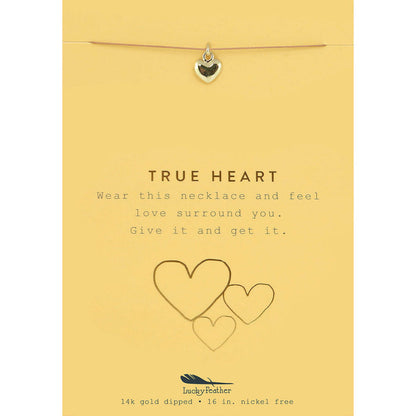 A 'True Heart' necklace on a yellow card with heart illustrations.