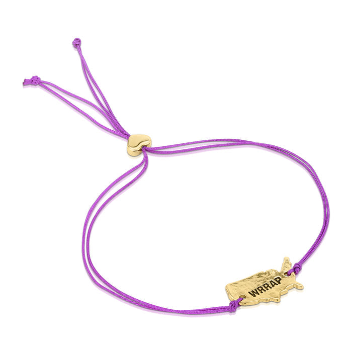 A purple cord bracelet features a gold-colored charm of the United States with 'WRRAP' on it.