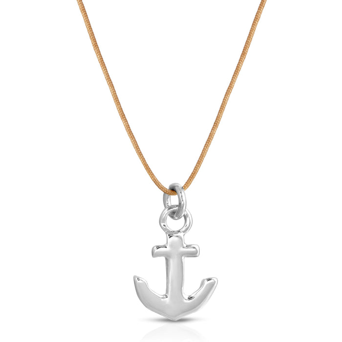 Silver anchor pendant hangs from a light brown cord against a white background.